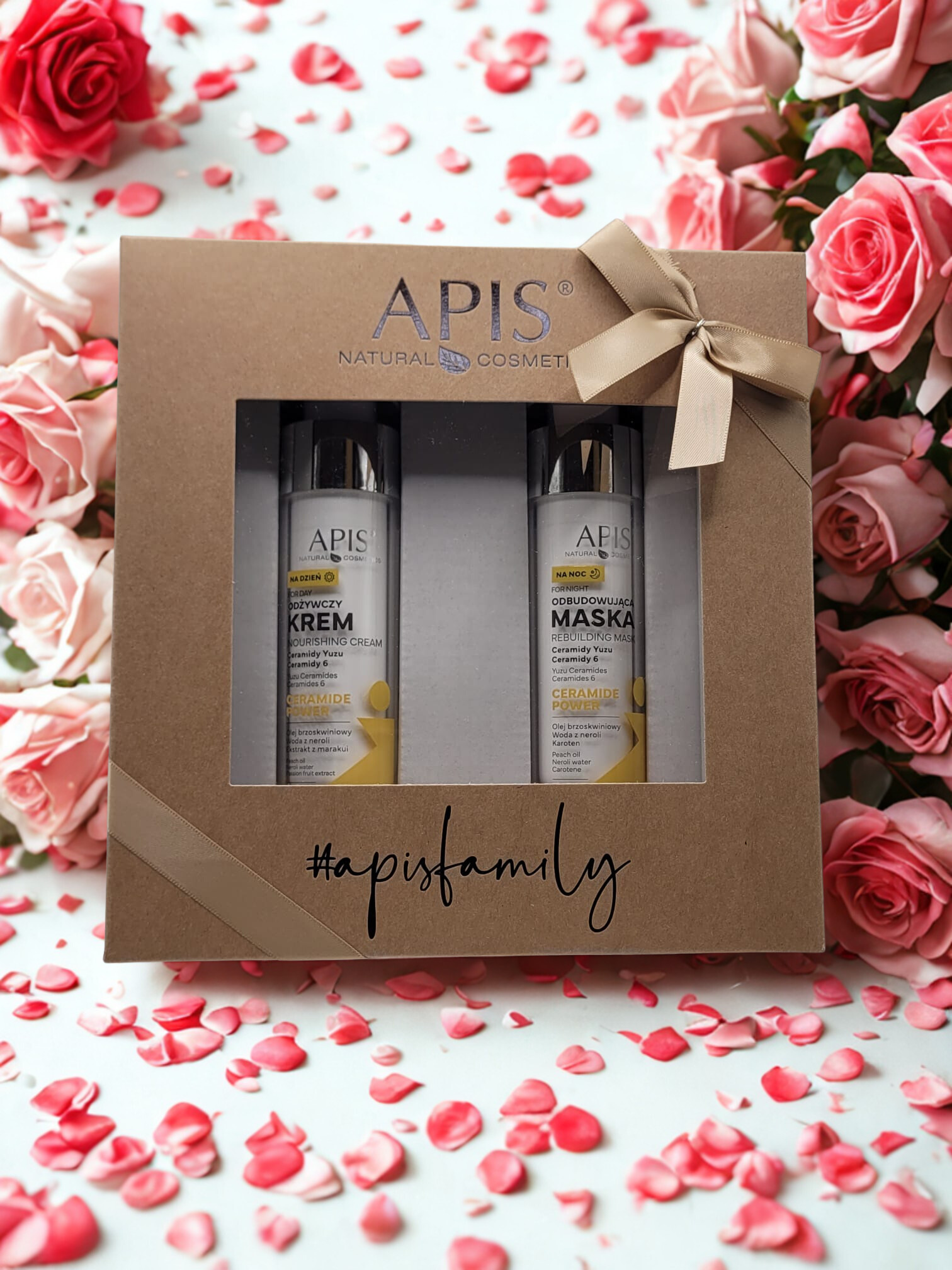 APIS cosmetic set in a box with roses and flower petals in the background