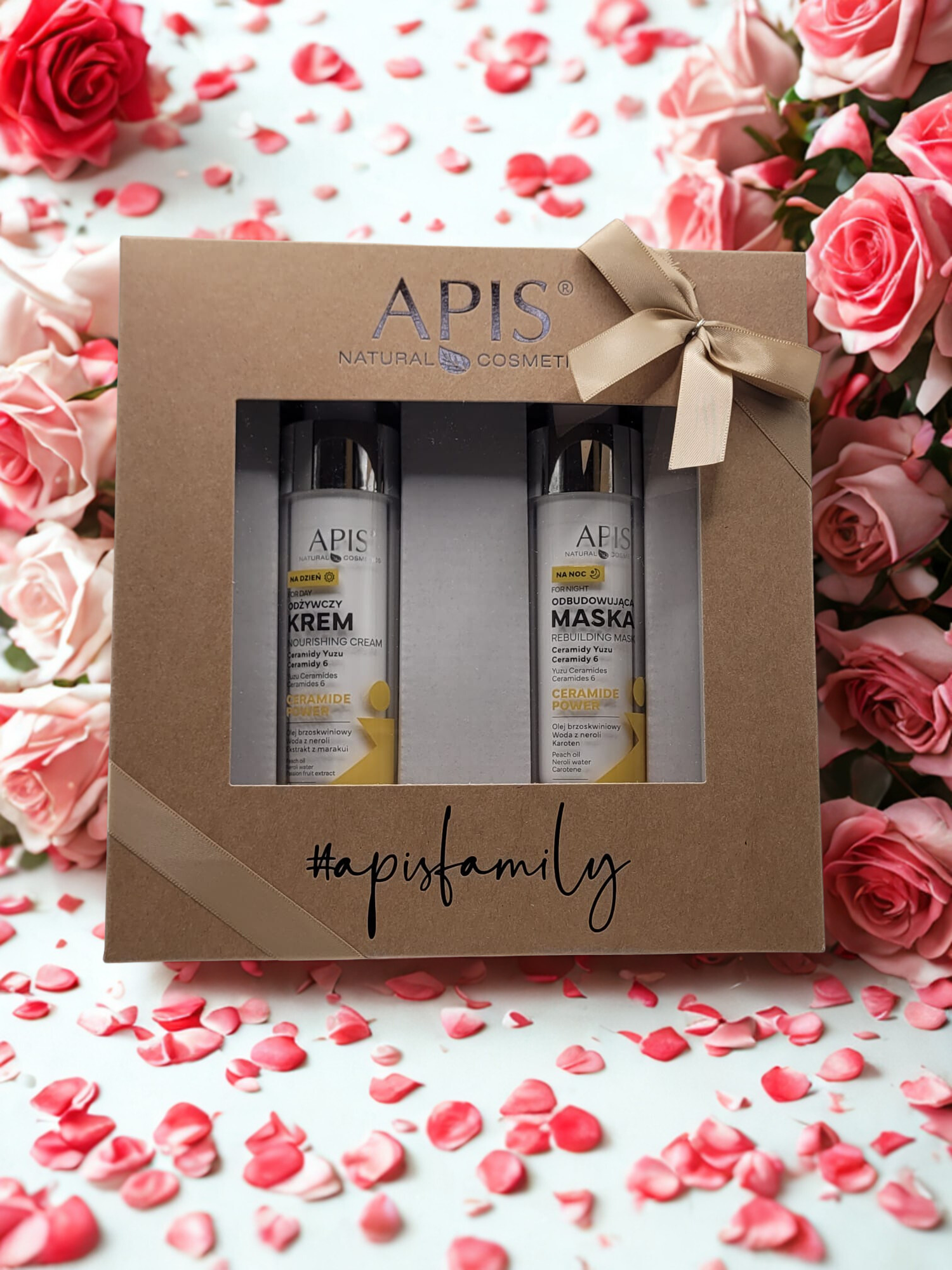 APIS cosmetic set in a box with roses and flower petals in the background