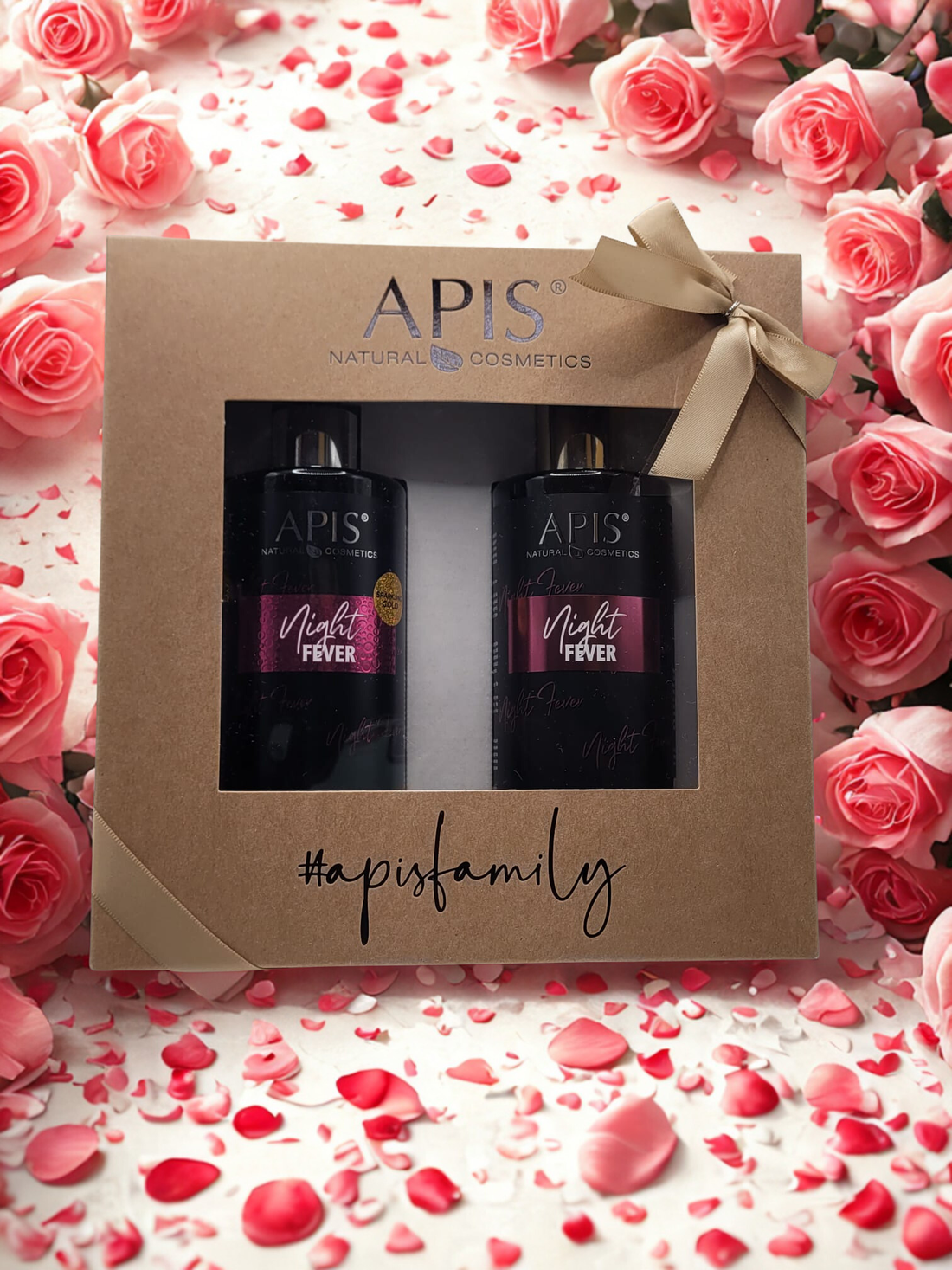 APIS natural cosmetics gift set with bottles and packaging on a floral background
